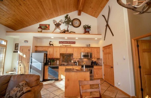 Stanley Hills Condo | Spectacular views of Lake Estes, private patio, hot tub, fireplace.