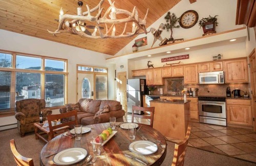 Stanley Hills Condo | Spectacular views of Lake Estes, private patio, hot tub, fireplace.
