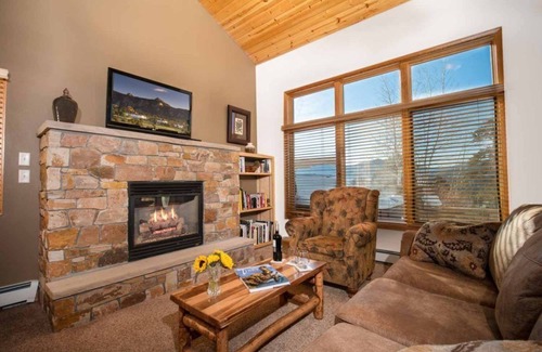 Stanley Hills Condo | Spectacular views of Lake Estes, private patio, hot tub, fireplace.