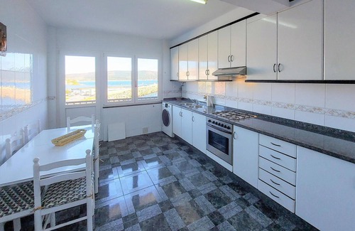 Fisterra Apartment | Spend a relaxing time out in this vacation apartment right by the sea.