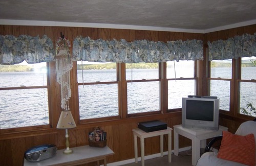 Laconia House | SPLASH. CAN'T GET CLOSER TO THE WATER! WATERFRONT HOME BOAT HOUSE &BOAT SLIPS