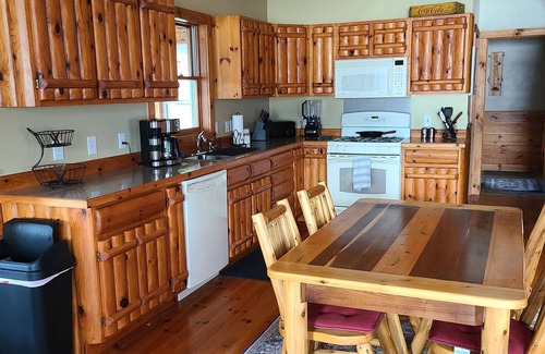 Lachine House | Spread out in our spacious double lot lakefront cabin!