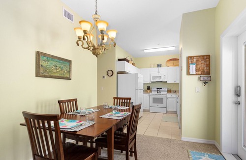 New Smyrna Beach Condo | Stay ON Flagler Avenue! Charming Condo with Full Kitchen, Parking and Courtyard!