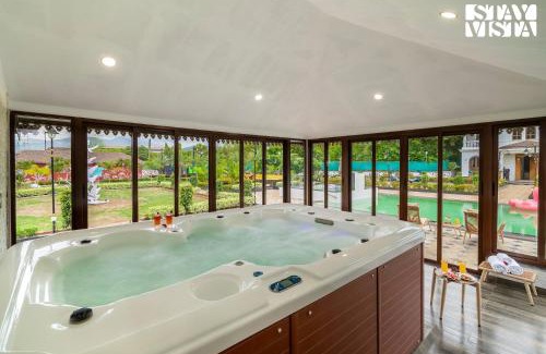 Karjat Villa | StayVista's Ashwamedha Manor - Mountain-Side Luxury Retreat with Outdoor Pool, Jacuzzi, Spa & Steam Room, and Indoor Activities