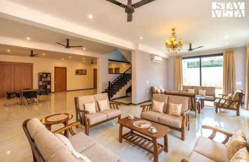 Gurugram Villa | StayVista's Shivoham Farms - Mountain-View Villa with Outdoor Pool, Lawn, and Terrace
