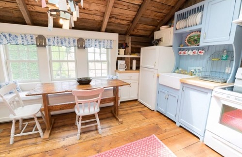 Chatham House | Step back in time in this beautifully maintained antique horse barn cottage!