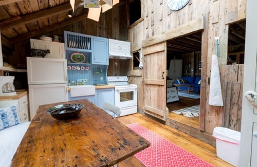 Chatham House | Step back in time in this beautifully maintained antique horse barn cottage!