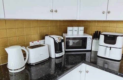 Port Talbot House | Step-free retreat by the sea with garden & parking