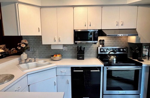 Michaywe House | Step into Time Capsule Tower, a retro 70s escape with 5 themed bedrooms, movie room, hot tub, sauna, arcade & more. Centrally located near Northern Michigan golf, lakes, skiing, & off-road and snowmobile trails with access to a community pool.