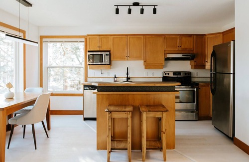 East Kootenay House | Steps from the lift, quick pedal to the trails, short drive to golf.