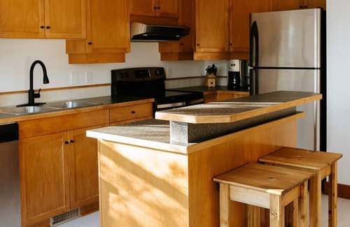 East Kootenay House | Steps from the lift, quick pedal to the trails, short drive to golf.