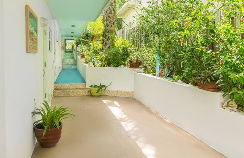 Juno Beach House | Steps to the Beach. Prime Location. Beach Bungalow Chic.