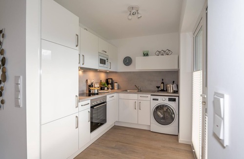 Busum Apartment | Stillvoll Eingerichtete Ferienwohnung mit Sauna, Kamin, Terrasse und Waschtrockn
