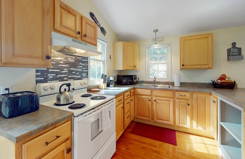 Frank House | Streamside cottage on +2 acres with large deck, firepit, fireplace, & W/D