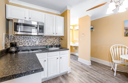 Surf City Apartment | Studio condo with ocean views, pool, deck, & central AC