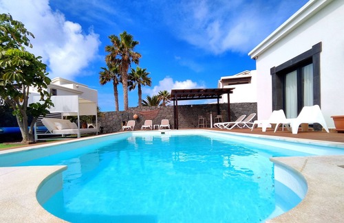 Playa Blanca Villa | Stunning detached villa with sea view, beautiful landscaped gardens, A/C & wifi