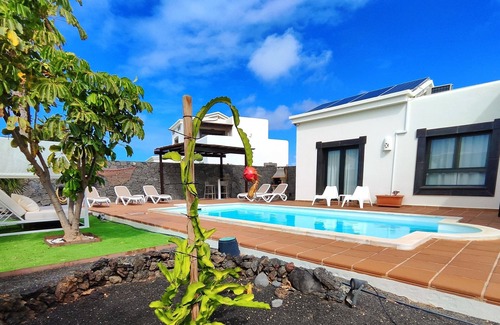 Playa Blanca Villa | Stunning detached villa with sea view, beautiful landscaped gardens, A/C & wifi