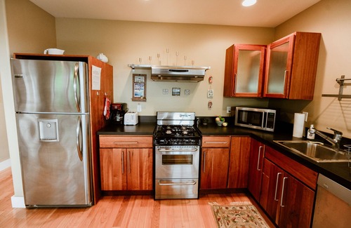 Leland House | Stunning views of Leland Harbor & Fishtown, and sunsets between the Manitou's!