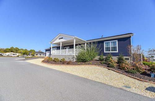 Long Neck House | Stunning waterfront home, beach, pools, pet friendly!