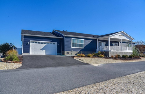 Long Neck House | Stunning waterfront home, beach, pools, pet friendly!