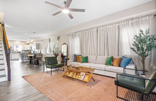 Near Northside Apartment | Stylish 3-Story Home Sleeps 14 Near Monon Trl WiFi, AC + Private Hot Tub