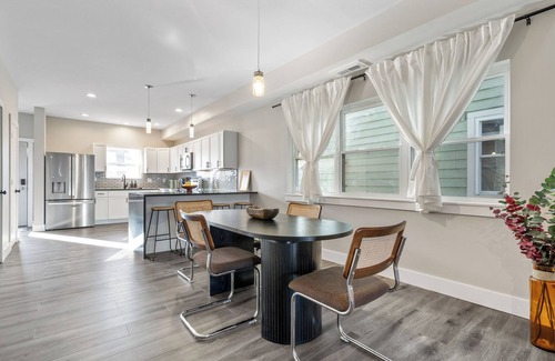 Near Northside Apartment | Stylish 3-Story Home Sleeps 14 Near Monon Trl WiFi, AC + Private Hot Tub