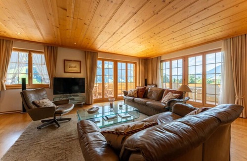 Rougemont Apartment | Stylish Alps apartment near Rougemont Village with mountain views.