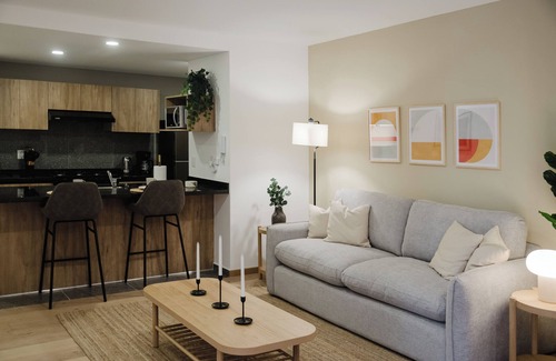 Cuauhtemoc Apartment | Stylish and cozy loft just one block from Roma Norte. Enjoy a comfy bed, smart TV, full kitchen, and fast Wi-Fi. The building features a rooftop pool with stunning views, gym, co-working area, and kids’ playroom.