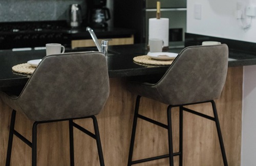 Cuauhtemoc Apartment | Stylish and cozy loft just one block from Roma Norte. Enjoy a comfy bed, smart TV, full kitchen, and fast Wi-Fi. The building features a rooftop pool with stunning views, gym, co-working area, and kids’ playroom.