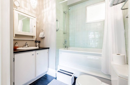 North End House | Stylish, dog friendly 2 bdrm main floor in duplex w fenced yard, onsite parking