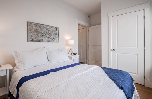North End House | Stylish, dog friendly 2 bdrm main floor in duplex w fenced yard, onsite parking
