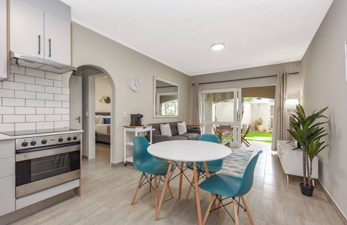 Sandown Apartment | Stylish Garden Retreat w/Pool and Modern Amenities