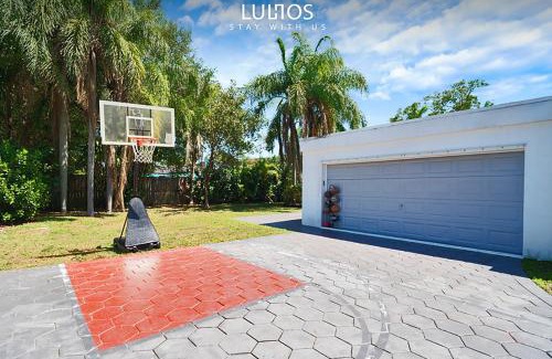 Cutler Bay House | Stylish Retreat Heated Pool Basketball Game Room L41