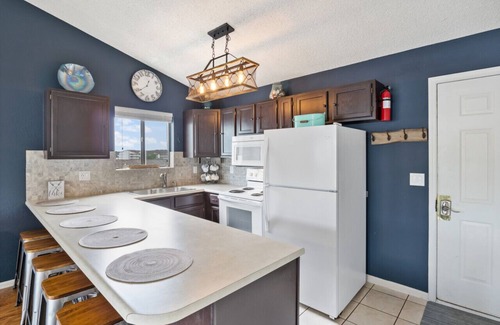 Village of Four Seasons Condo | Summertime Blues-Top Floor Waterfront!