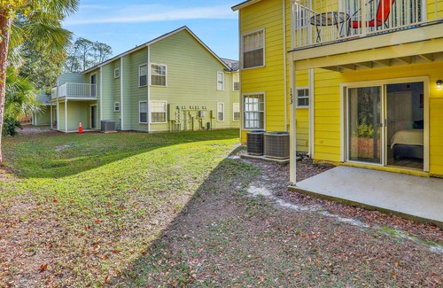 Royal Palm Bay Condo | Sunflower-yellow condo with pool, W/D, hot tub & kitchen - dog/snowbird-friendly