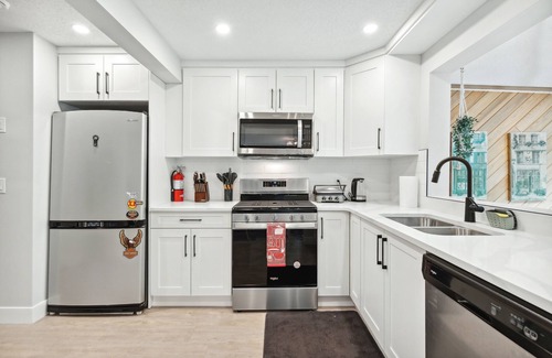 Southwest Calgary House | Sunlit Suite, Hot Tub Haven