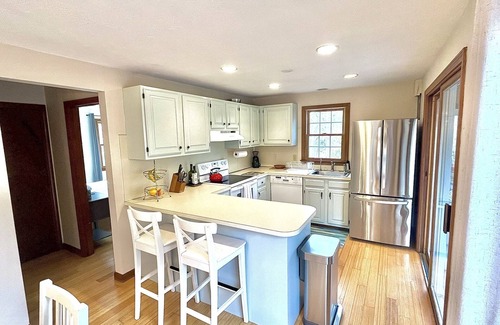 Lagoon Heights House | Sunny 3 bedroom cape with large deck, porch and kayaks. Pet friendly.