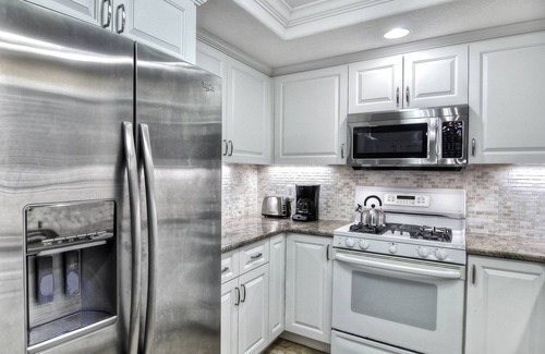 San Clemente Condo | Sunny condo with loft and spacious patio surrounded by palm trees