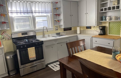 Ludington Apartment | Sunny, fresh, well-appointed, whimsical, cottage-style across from Copeyon Park!
