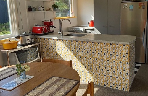 Huia House | Sunny house in sheltered bay, great views, classic kiwi ambience