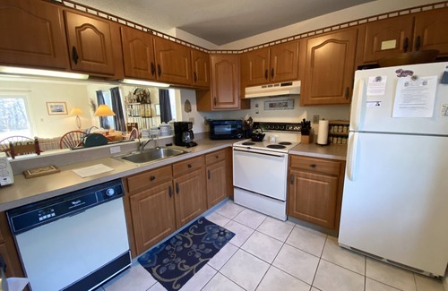 Brewster Condo | Sunny, single level Susanna Village patio home with golf course views and pool access.