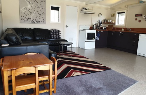 Waitarere Beach House | Sunny, well appointed bach for you to enjoy. Just minutes walk to the beach
