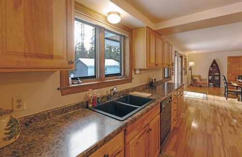 Three Lakes House | Sunrise Shores | Fun lakehome on Chain, dock, water toys, firepit, doggies ok