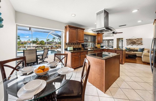 Caloosahatchee House | Sunset Canal - Waterfront Luxury, Heated Salt Pool, Dock, Kayaks, Bikes & Golf