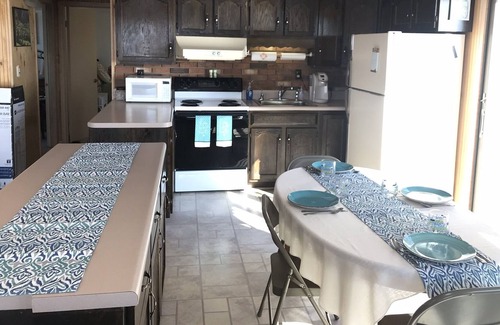 Town of Ledyard Cottage | Sunset Haven, lakefront on Cayuga Lake w/ Hot Tub, Waterslide & Boat Lift