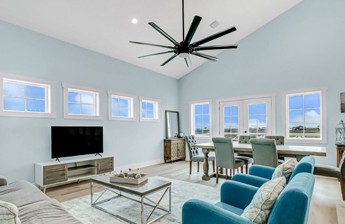 Rockport House | Sunset-view getaway with a wrap-around balcony, firepit, central AC, & W/D