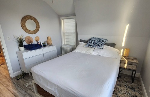 Queens Apartment | Surfer's Paradise 2 blocks from the beach in NYC with shared fenced-in backyard.