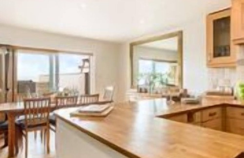 Lusty Glaze Cottage | Surfside - a large family home that sleeps 10 guests in 3 bedrooms