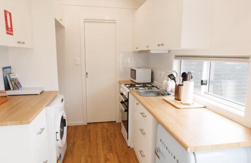 Wollongong Ski Chalet | Sweet beautiful TINY HOME with pool and 2 minute drive to the beach
