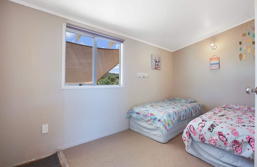 Taupo Bay House | The Beach Bach - Basic kiwi bach perfect for a relaxing holiday.